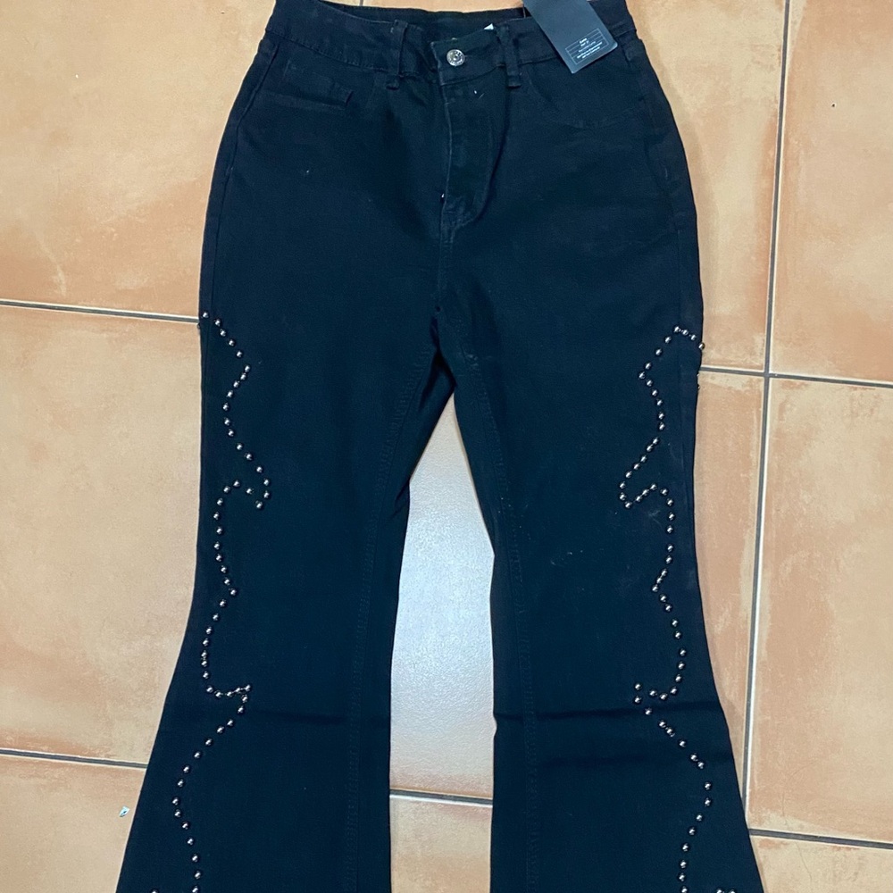 HOT!!  Long, black silver studded jeans.  New with tags. Size 29.